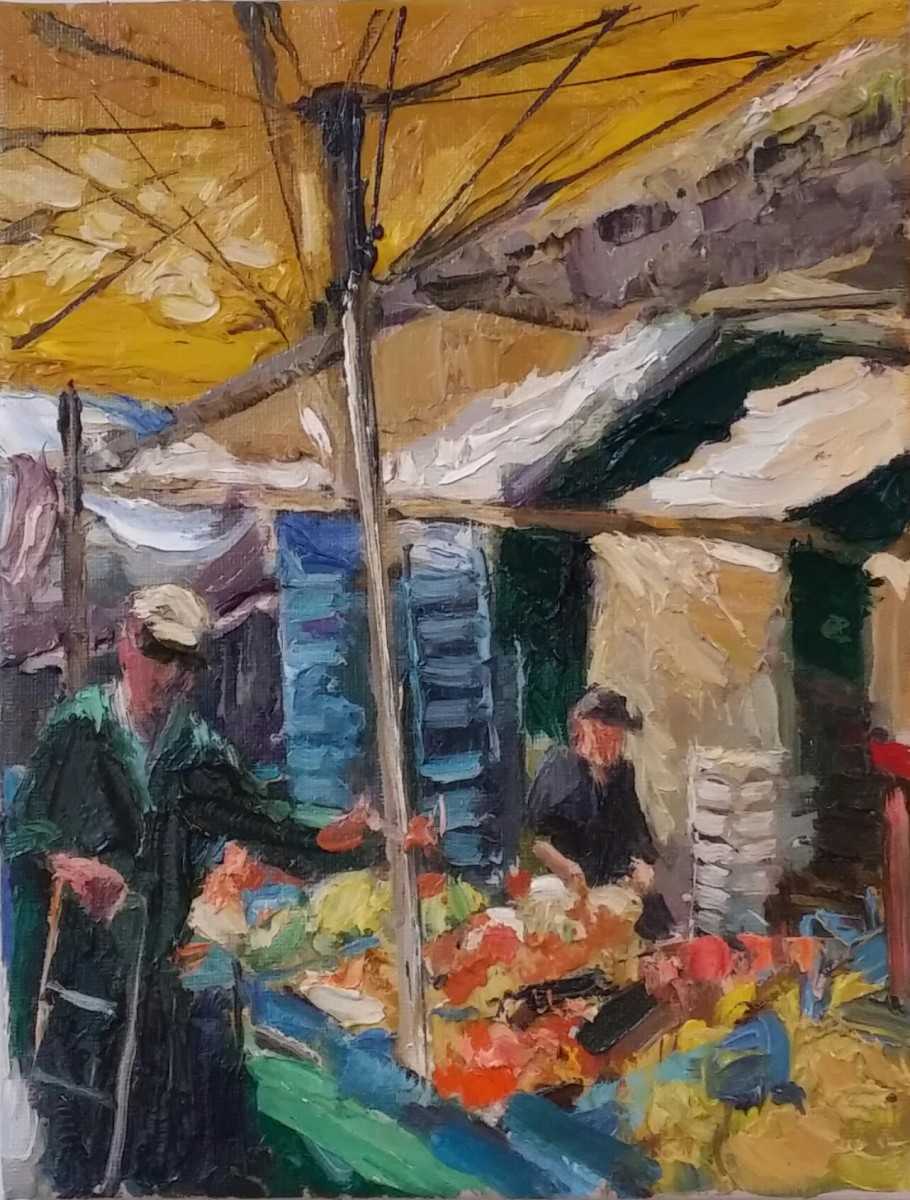Rob Jacobs schildert doek tijdens een markt.