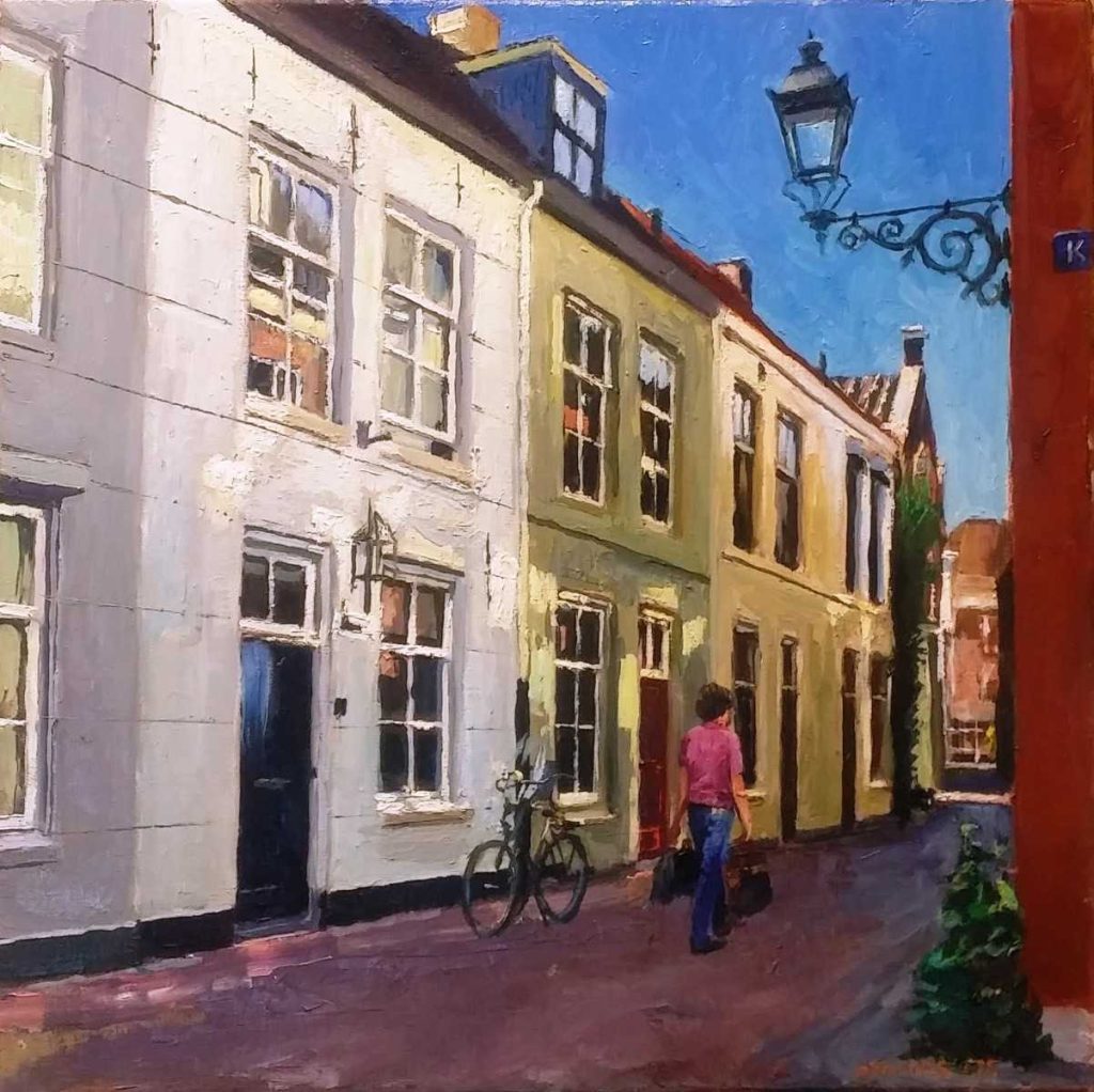 Rob Jacobs schildert doek van 40x40cm met een stadsgezicht.