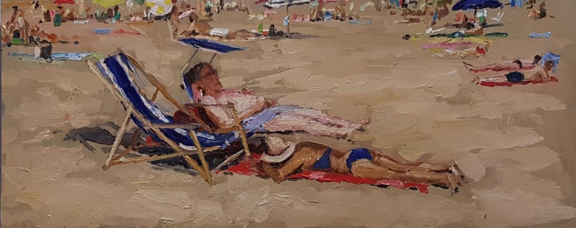 Rob Jacobs schildert doek van 58x24cm, tijdens strand, in Katwijk, Zuid-Holland.